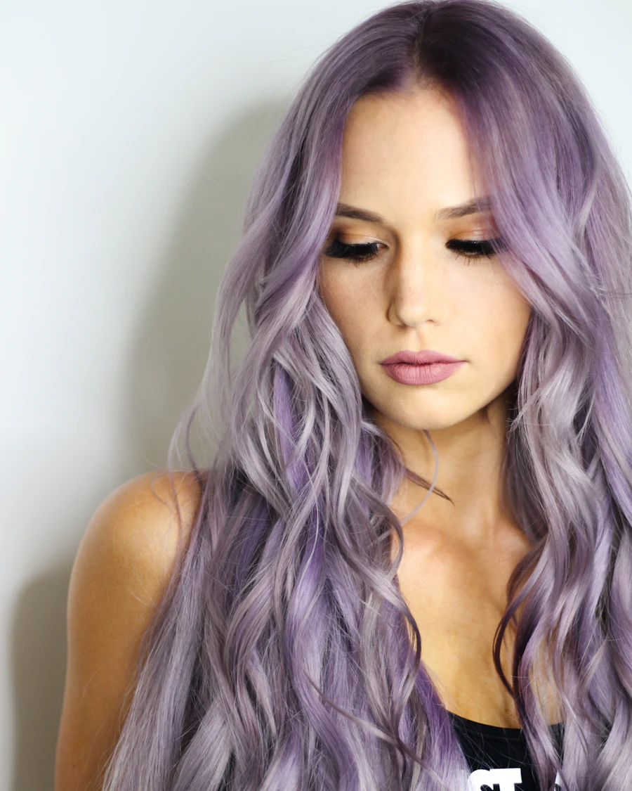 Woman with long lavender-coloured wavy hair