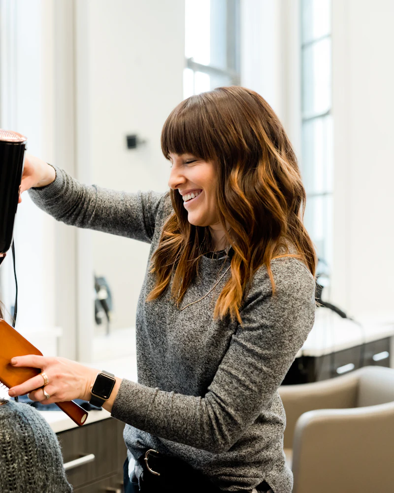Stylist applying hair colour