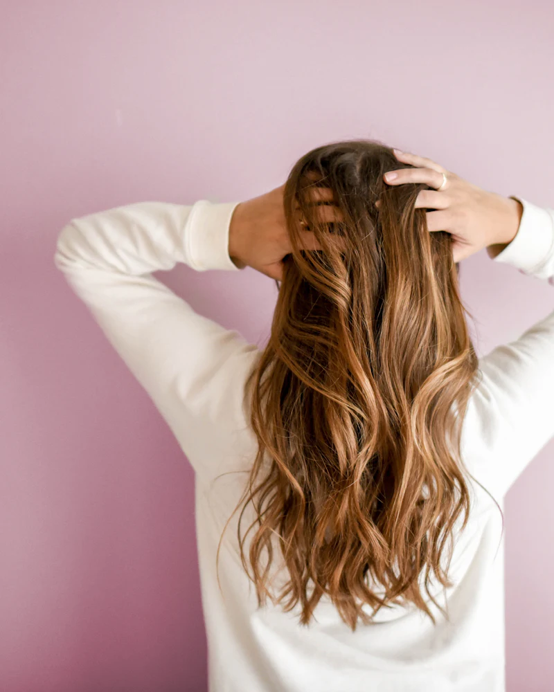 Woman with glossy long brown hair